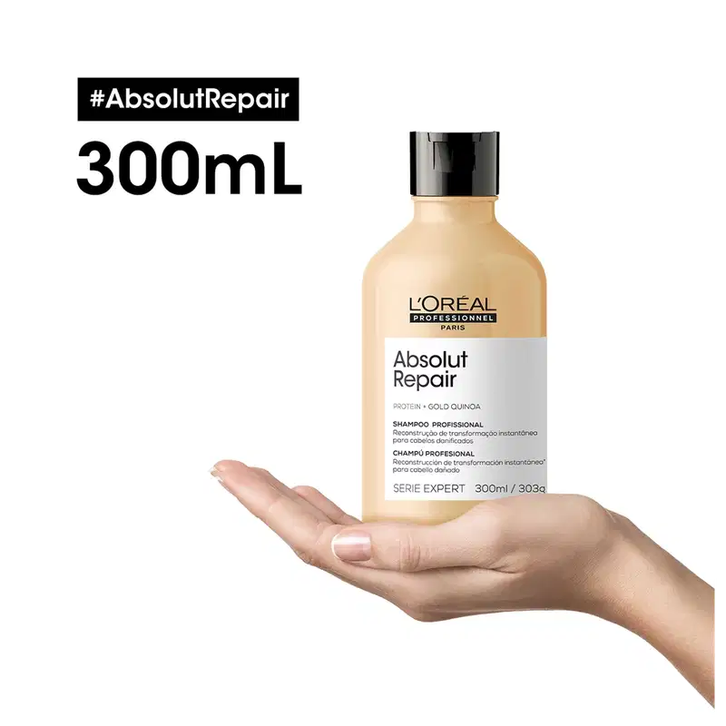 Frasco de 300 ml de shampoo profissional da marca L'Oreal Professionnel, da linha Absolut Repair, com rótulo branco e amarelo, contendo informações sobre os ingredientes e benefícios do produto.