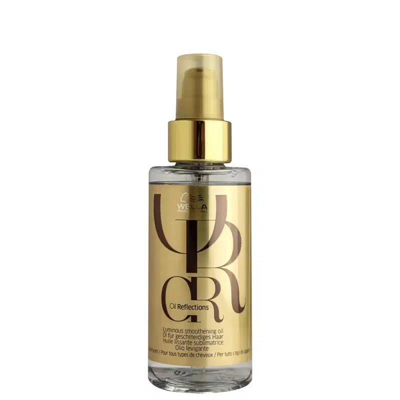 O produto apresentado é um óleo suavizante luminoso da linha Oil Reflections da Wella Professionals. O frasco é de vidro transparente com um bico pulverizador e uma tampa dourada.