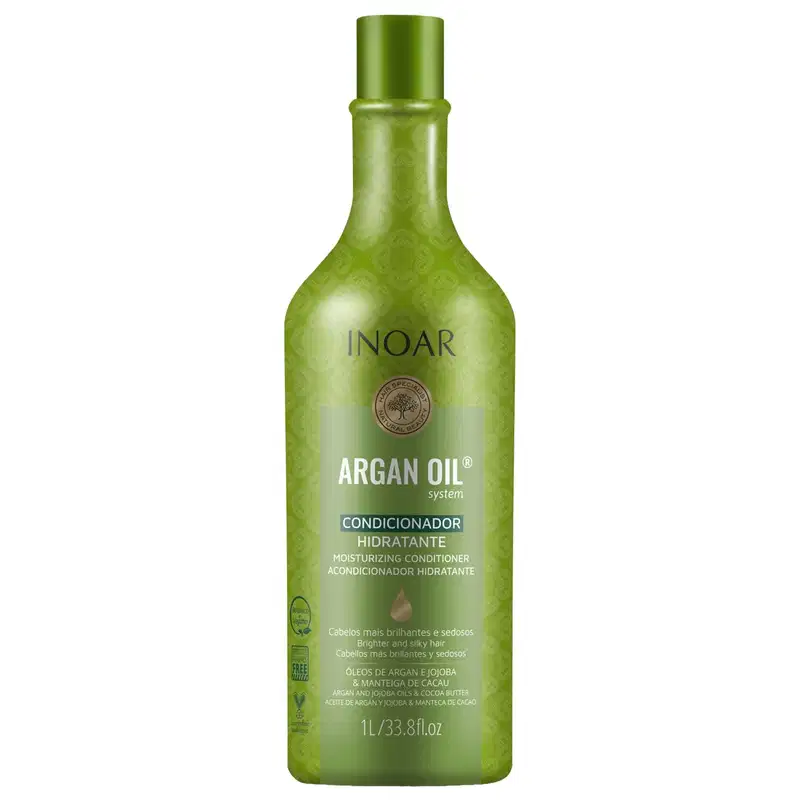 Condicionador hidratante Argan Oil da linha Inoar. Embalagem em frasco plástico verde transparente com formato cilíndrico e tampa verde. Rótulo com o nome do produto "Argan Oil system Condicionador Hidratante" em letras brancas e cinza.