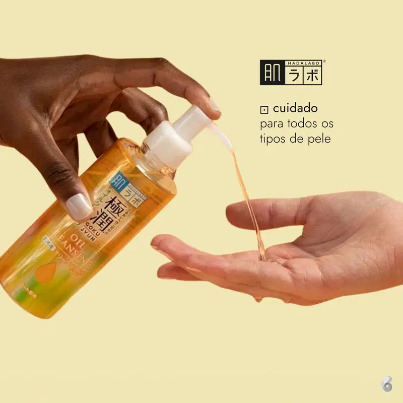 Imagem de um frasco de óleo para cuidados com a pele da marca Hadalabo, em um fundo amarelado, com as mãos aplicando o produto. O texto em português indica que o produto é adequado para todos os tipos de pele.