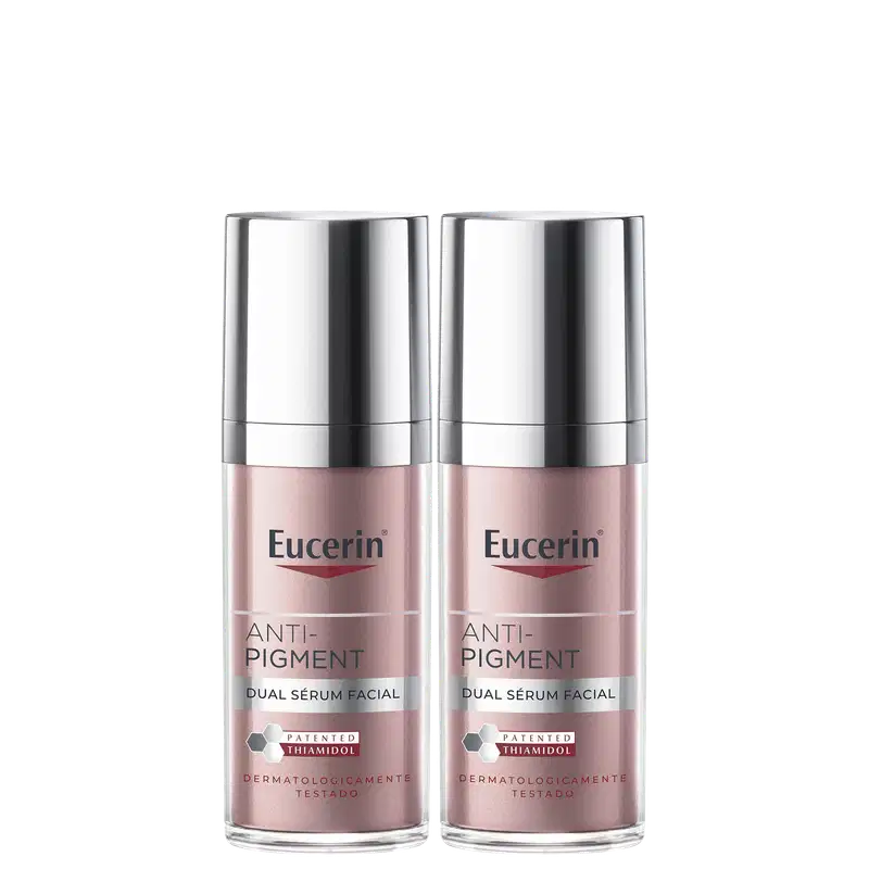 Dois frascos de serum facial Anti-Pigment da marca Eucerin, com embalagem prateada e rosa, apresentando o texto "Anti-Pigment Dual Sérum Facial" e o logotipo da marca.