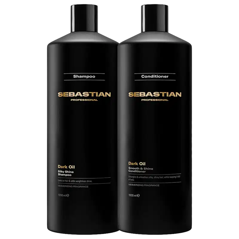 Dois frascos pretos da marca Sebastian Professional, um de shampoo e outro de condicionador da linha Dark Oil, com rótulos em dourado destacando o nome da marca e o tipo de produto.