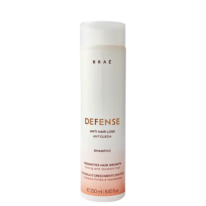 Frasco branco cilíndrico da marca Braé, contendo 250 ml de shampoo "Defense Anti Hair Loss Antiqueda" para promover o crescimento capilar.