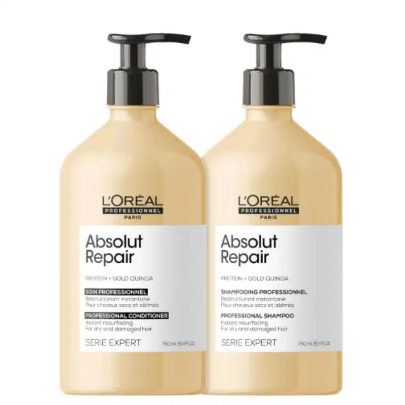 Shampoo e condicionador da linha Absolut Repair da L'Oréal Professionnel, com embalagens de plástico bege e detalhes em preto, contendo informações sobre os ingredientes e benefícios do produto.