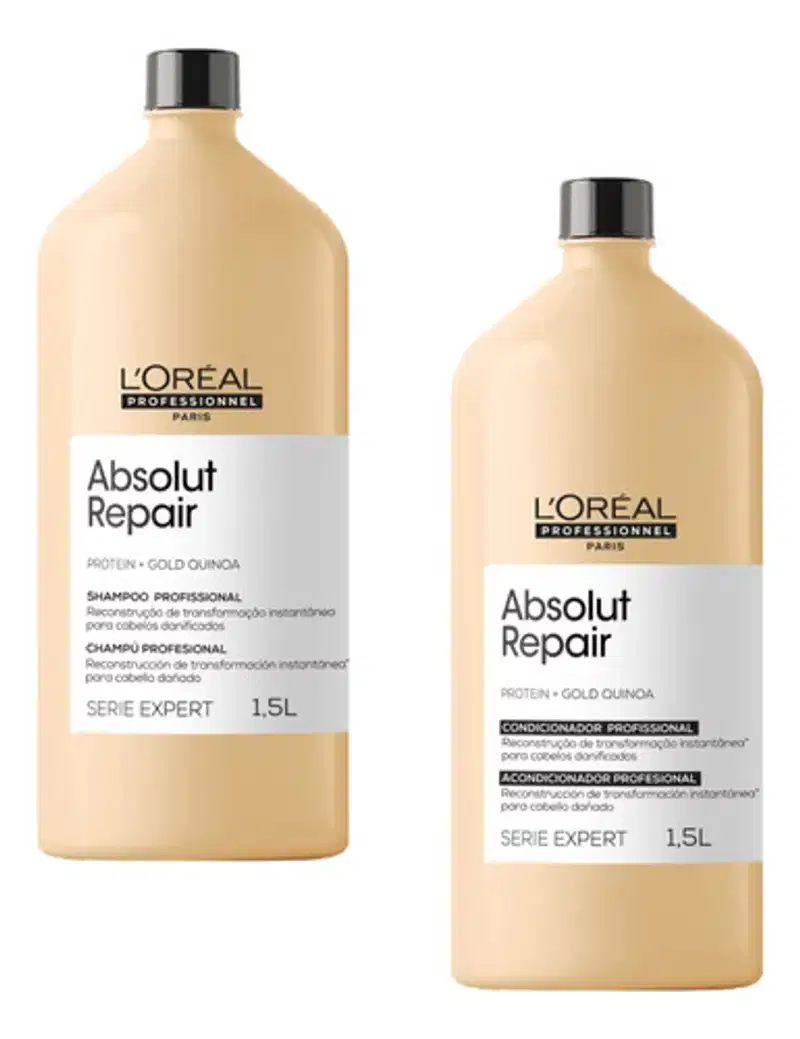 São dois frascos grandes de 1,5 litros da linha Absolut Repair da L'Oréal Professionnel. Os frascos têm uma cor bege claro e tampas pretas. Um frasco é rotulado como "Shampoo Profissional", enquanto o outro é rotulado como "Condicionador Profissional".