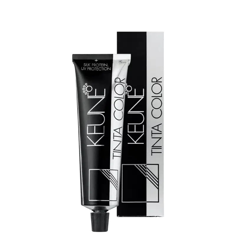 Produto de coloração permanente para cabelos Tinta Color da marca Keune. Embalagem retangular preta com detalhes em branco contendo o nome do produto e da marca.