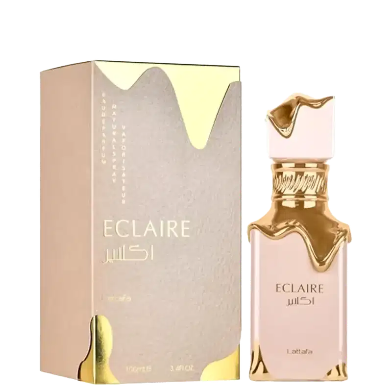 Frasco de perfume dourado da marca Lattafa Perfumes, chamado "Eclaire", em embalagem de caixa cinza com detalhes dourados. O frasco possui um design elegante e sofisticado.