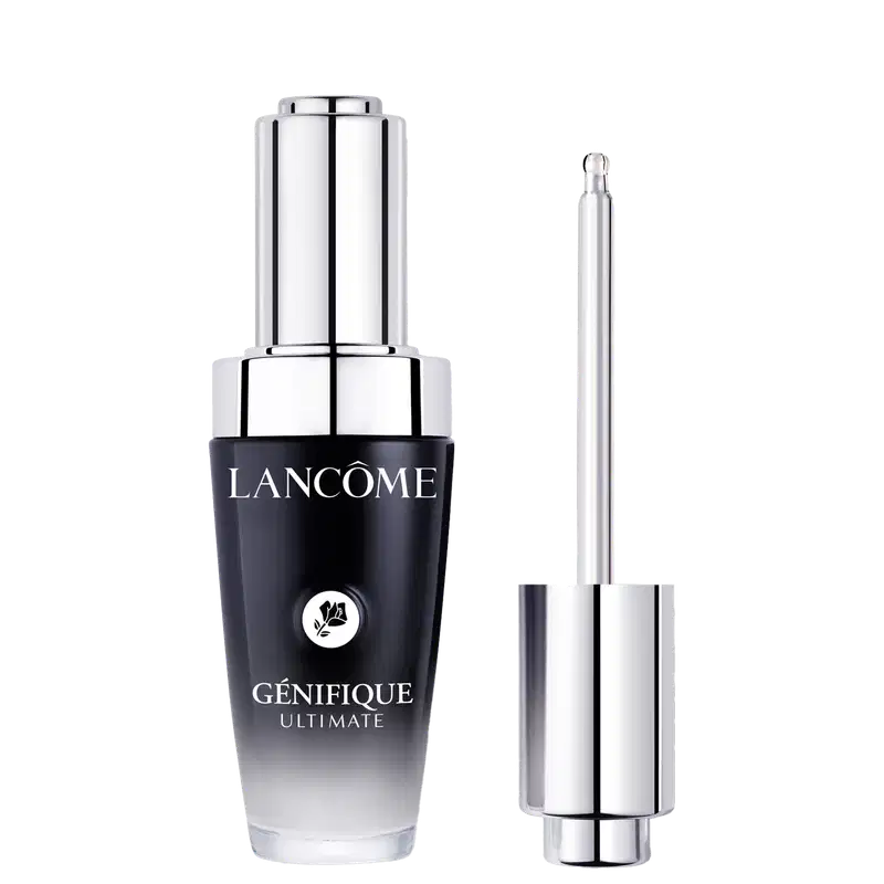O frasco é preto com detalhes em prata, com o logotipo da marca Lancôme e o nome do produto "Génifique Ultimate" claramente visíveis. Ao lado  há um aplicador conta-gotas.