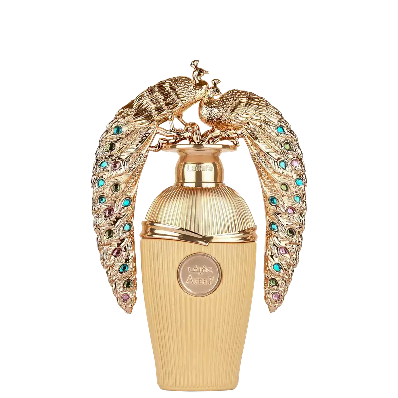 Frasco de perfume dourado da marca Lattafa, com detalhes em formato de pavões dourados e pedras coloridas, apresentando uma embalagem luxuosa e ornamentada.