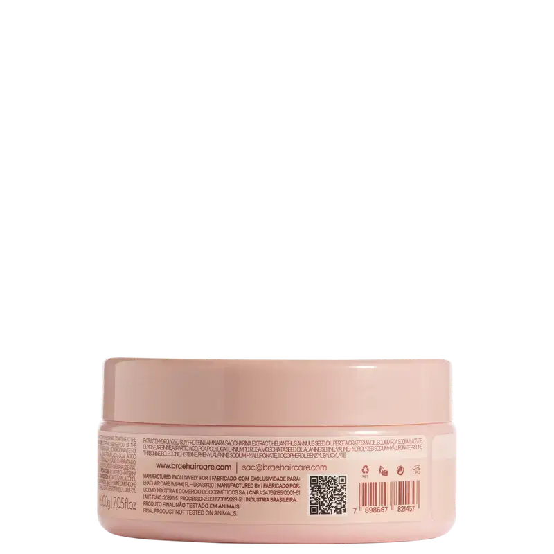 Pote plástico rosa claro com máscara capilar. Embalagem redonda com tampa rosada. Rótulo na parte inferior com informações do produto em português e inglês, incluindo ingredientes, código de barras e indicação de não testado em animais.