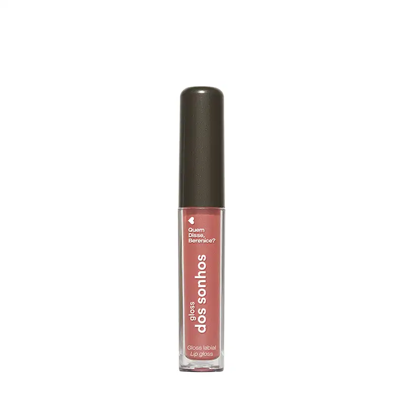 Gloss labial Dos Sonhos contendo o texto "Quem disse, Berenice?". O produto apresenta uma textura brilhante e uma cor rosada suave.