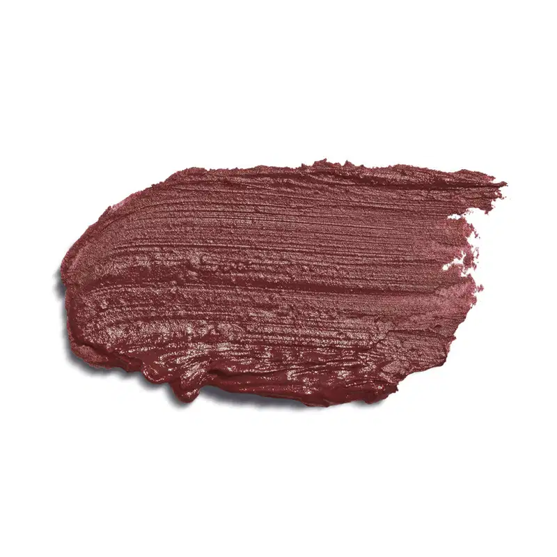 Trata-se de uma textura cremosa e de cor marrom nude. A embalagem não é visível, mas o produto em si é mostrado em destaque contra um fundo branco, permitindo uma visualização clara de sua tonalidade e acabamento.
