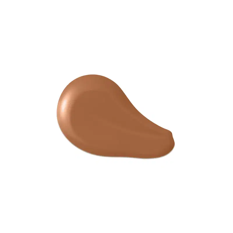 O produto apresentado na imagem é uma base de maquiagem de cor marrom escuro, com uma textura cremosa e suave. Sua forma é arredondada e convexa. Não há rótulos, marcas ou outras informações visíveis na imagem.
