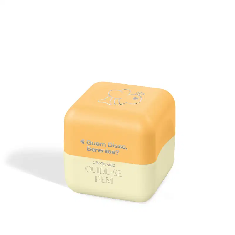 Balm Labial em formato hexagonal com duas cores. A parte superior é amarela com o desenho estilizado de uma abelha e o texto "Quem Disse, Berenice?". O design é minimalista, com apenas os elementos textuais e o ícone da abelha