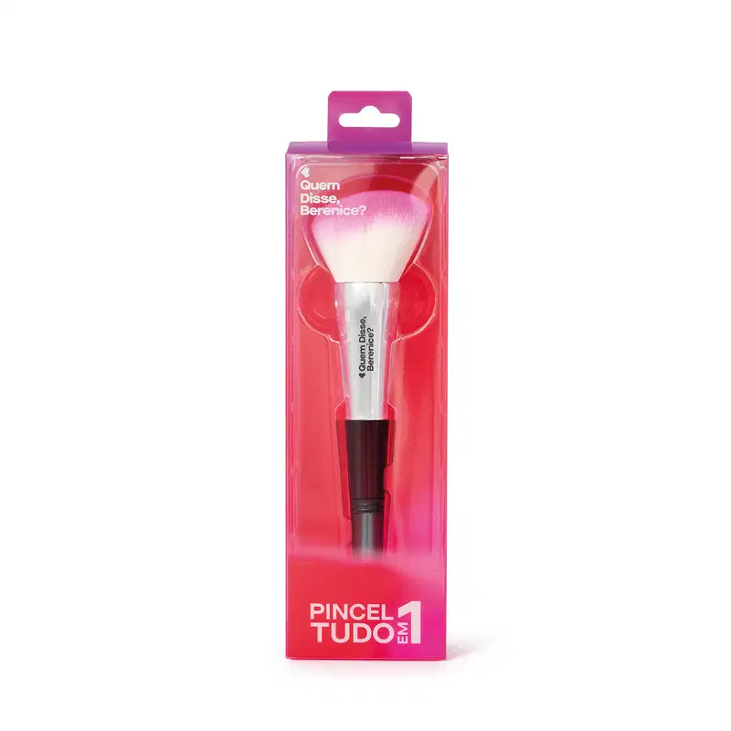 Pincel de maquiagem com cabo preto e cerdas brancas em embalagem rosa com texto em inglês. O produto é apresentado em uma caixa de plástico transparente com detalhes em rosa.