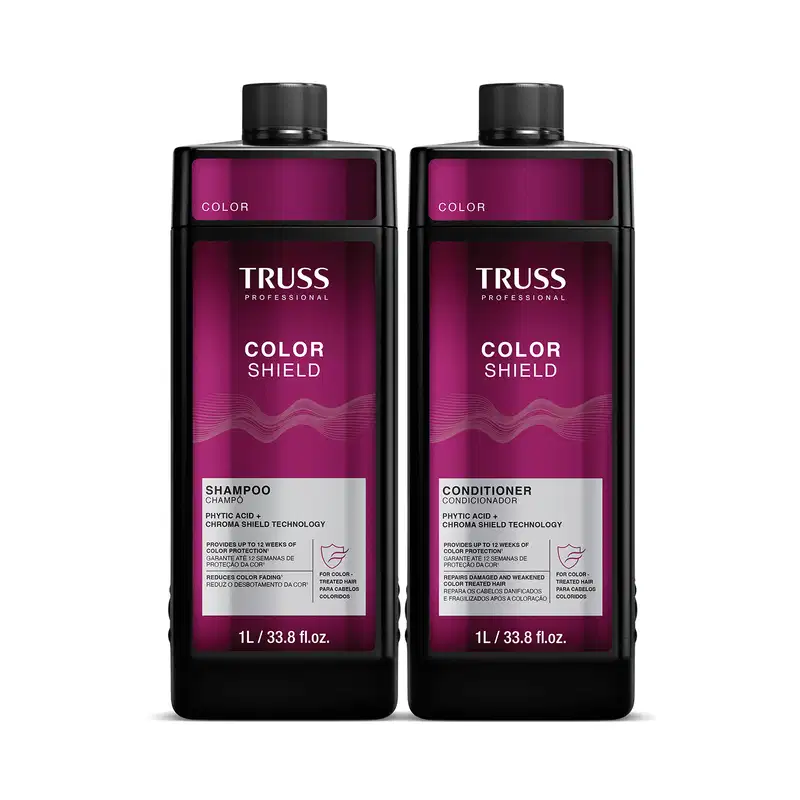 Dois frascos de 1L da linha Color Shield da Truss Professional, contendo shampoo e condicionador para proteção da cor dos cabelos. Embalagens pretas com detalhes em roxo, exibindo o nome da marca e do produto.