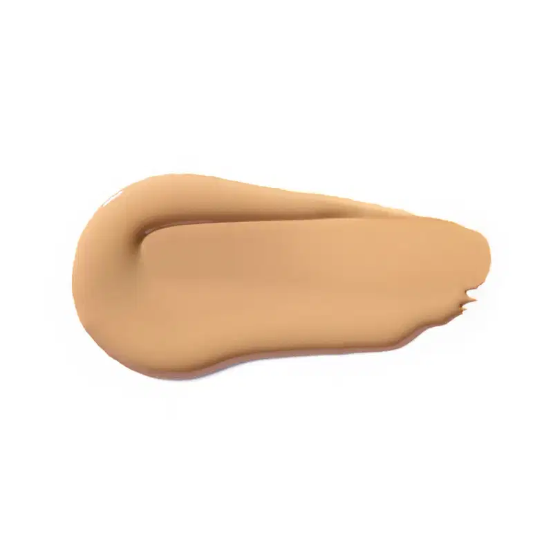 Textura cremosa e suave, com tonalidade bege clara, apresentando aspecto homogêneo e uniforme, típica de um produto de base ou corretivo da marca Vult.