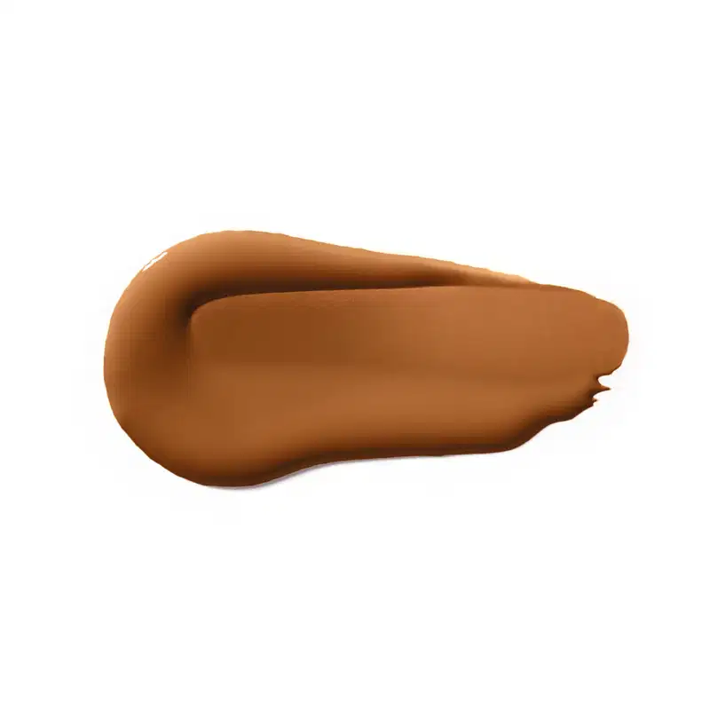 Textura cremosa e sedosa, com tonalidade marrom-dourada, sugerindo um produto de beleza da marca Vult com acabamento aveludado e aspecto suave ao toque.