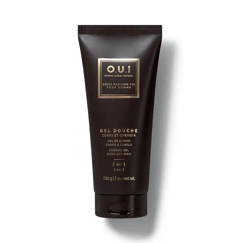 Frasco preto de gel de banho da marca O.U.i, com rótulo dourado em formato retangular contendo informações sobre o produto.
