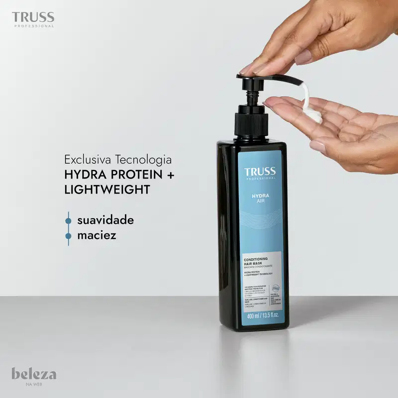 Frasco preto da linha Truss Professional, Hydra Air, com bomba dosadora e rótulo azul com texto "Hydra Air Conditioning Hair Mask" e informações sobre tecnologia "Hydra Protein + Lightweight".