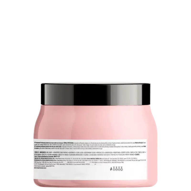 Recipiente de item de perfumaria rosa com tampa preta. Embalagem cilíndrica com rótulo branco contendo informações sobre o produto. Produto de beleza com design minimalista e cores neutras.