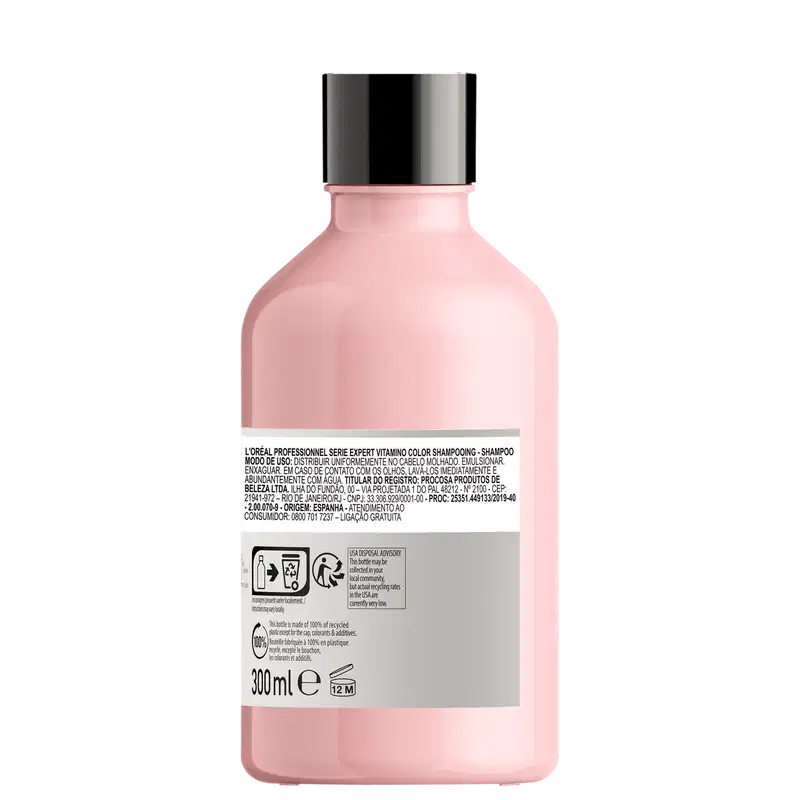 Frasco de item de perfumaria rosa com rótulo branco. Recipiente cilíndrico com tampa preta. Texto em português no rótulo indica tratar-se de um shampoo da marca L'Oreal.