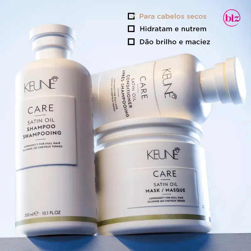 Produtos de cuidados capilares da marca Keune, incluindo shampoo e máscara de óleo de seda, apresentados em embalagens brancas e azuis, em um ambiente de fundo claro, destacando os benefícios do tratamento para cabelos opacos e sem brilho.