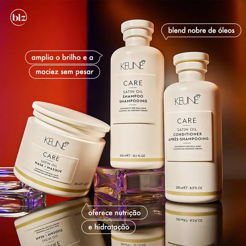 Ambiente de produtos de beleza da marca Keune, com embalagens de shampoo, condicionador e máscara de óleo de seda em tons de branco e dourado, destacados em um fundo vermelho e laranja, sugerindo uma apresentação de produtos para cuidados capilares.