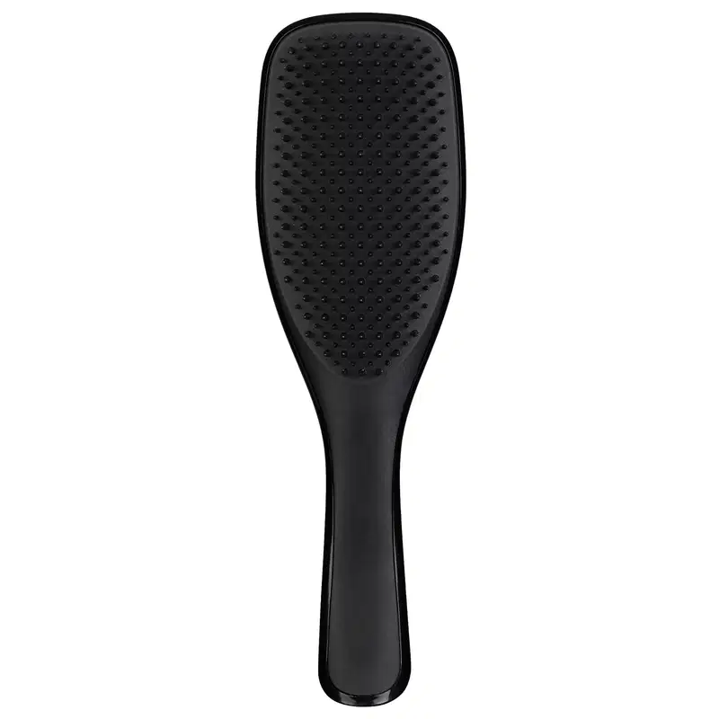 Escova de cabelo preta da marca Tangle Teezer, com design ergonômico e superfície ponteada para facilitar o desembaraço dos fios.