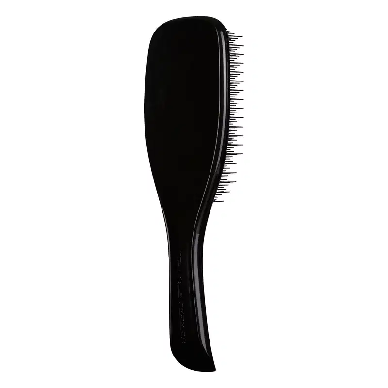 Escova de cabelo preta da marca Tangle Teezer, com design ergonômico e superfície ponteada para facilitar o desembaraço dos fios.