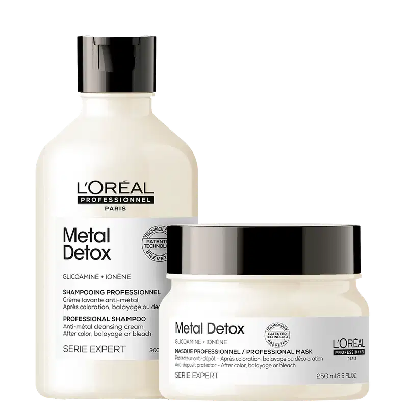 Produtos da linha Metal Detox da L'Oréal Professionnel, incluindo um frasco de shampoo e um pote de máscara, ambos com embalagem branca e preta com detalhes em prata.