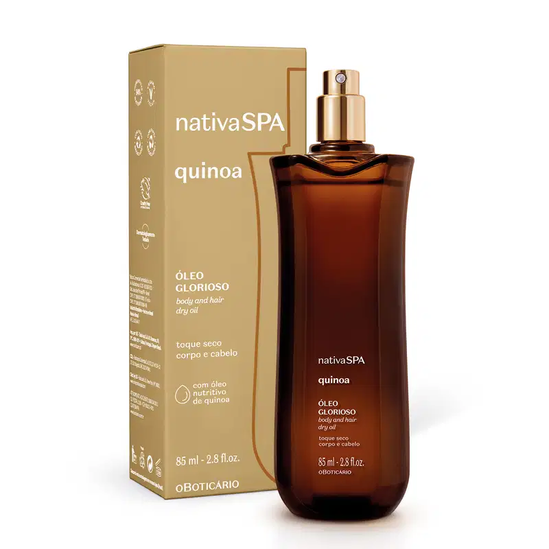 Vidro alongado marrom com pulverizador dourado e letras brancas contendo óleo multifuncional glorioso corpo e cabelos da marca Nativa SPA Quinoa ao lado de sua caixa em bege escuro com letras brancas.
