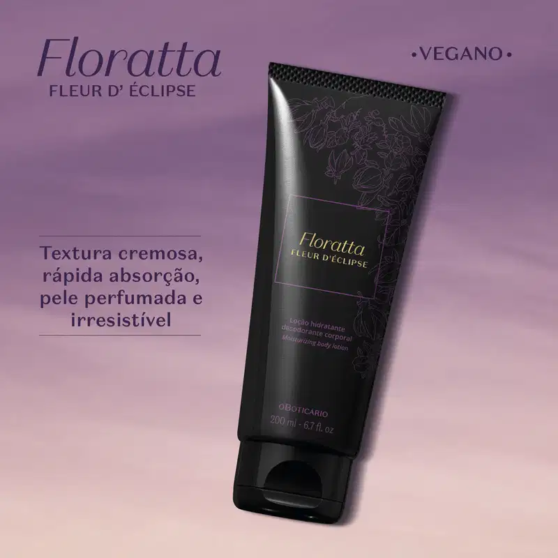 Bisnaga preta com letras e detalhes dourados contendo 200g de loção hidratante corporal Floratta Fleur d' Éclipse sobre fundo degradê roxo e rosa, com texto descritivo e marca Oboticário visível na embalagem.