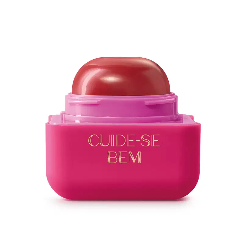 Pote compacto com cantos arredondados em tons de rosa com roll-on rosa escuro contendo hidratante labial Intense & Cuide-se Bem Cereja Livre.