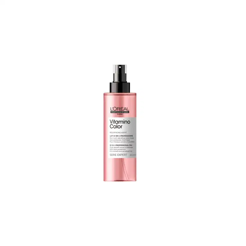 Frasco rosa com pulverizador preto da linha Vitamino Color da L'Oréal Professionnel, um produto de tratamento para cabelos coloridos com proteção térmica.