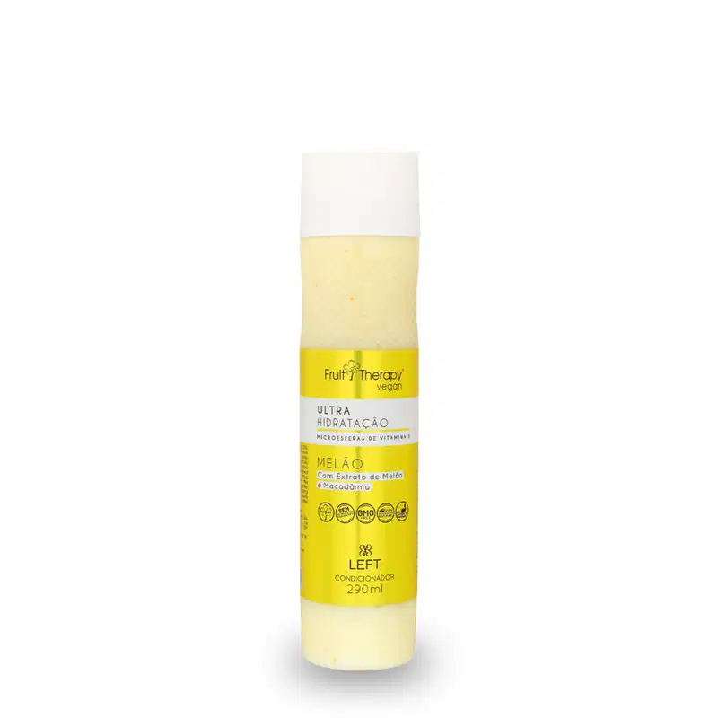 A imagem mostra um frasco amarelo e branco de condicionador da linha Fruit Therapy Vegan Melão. O frasco tem um design atraente, com cores vivas e informações detalhadas sobre benefícios, composição, além de certificações veganas e não testado em animais.
