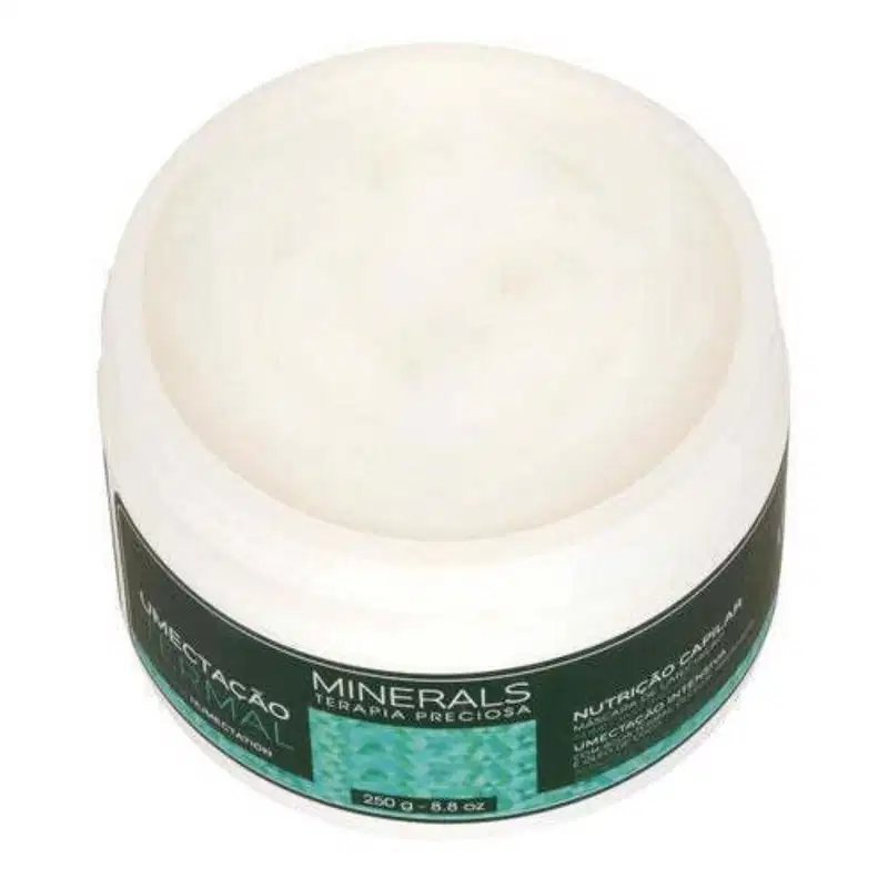 A imagem traz a máscara de tratamento da linha Minerals Terapia Preciosa Umectação Termal com o pode aberto onde é possível ver o conteúdo branco cremoso dentro.